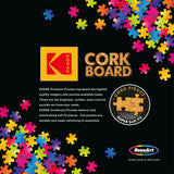 RoseArt - Kodak Cork - Coffee - 1000 Piece Jigsaw Puzzle advertisement featuring colorful puzzle pieces. The text highlights premium quality, vibrant colors, soft fit pieces, and durability of Kodak and RoseArt branded puzzles.
