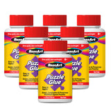 Image of six RoseArt - 4.5 oz Puzzle Glue 6 pack bottles. Each bottle has a red screw cap and a label displaying the brand name, product name, and usage details. The glue is described as non-toxic and suitable for ages 8 and up.