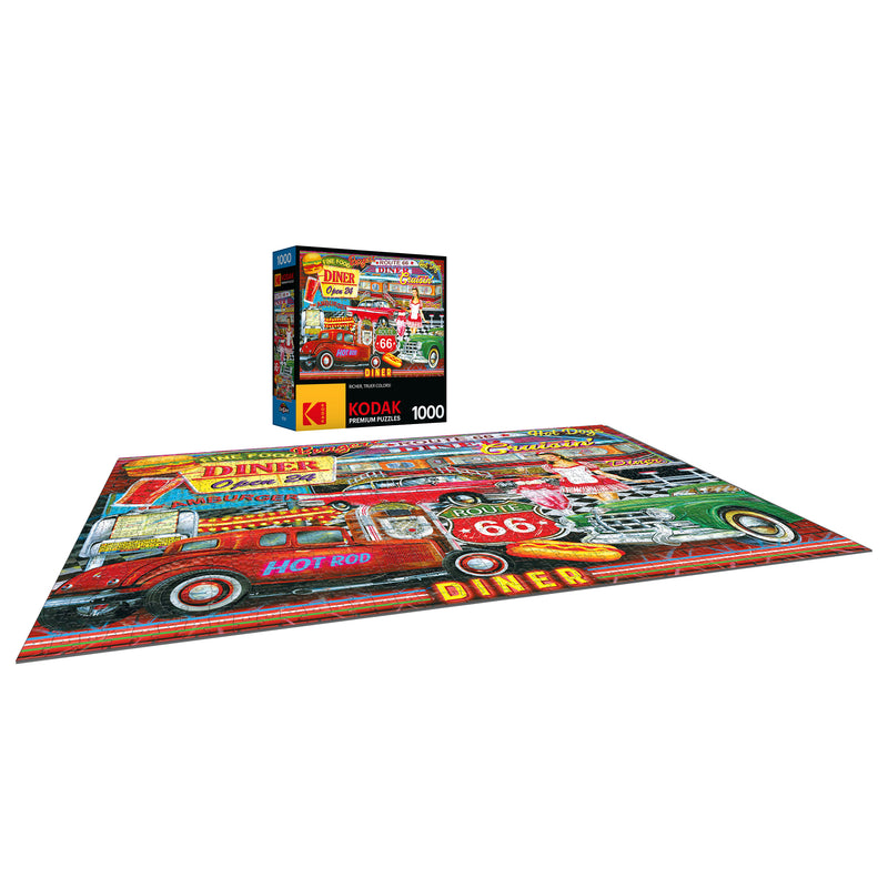 A completed RoseArt - Kodak Premium - 50's Diner - 1000 Piece Jigsaw Puzzle featuring a vintage diner scene with a red hot rod car, placed next to its box which displays the same image.