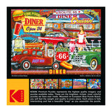 A puzzle image of a 50's-themed diner with vintage cars, neon signs, and a waitress serving food. The puzzle box states it is from RoseArt - Kodak Premium - 50's Diner - 1000 Piece Jigsaw Puzzle.