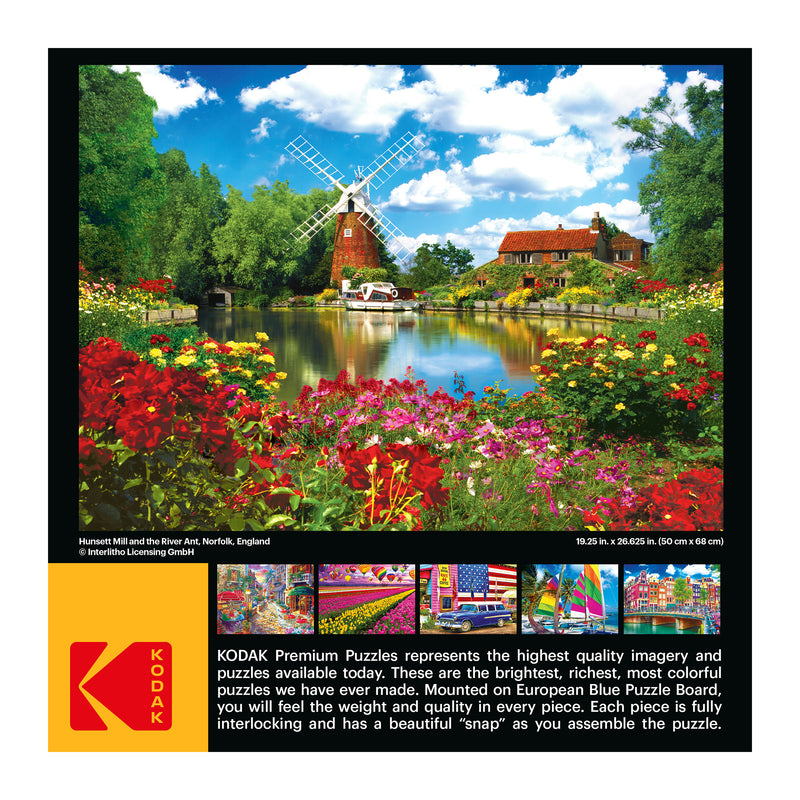 Box cover of a puzzle depicting Harnser Mill and river, with picture of a mill, houses, boats, and flowers. Includes RoseArt - Kodak Premium - Hunsett Mill and the River Ant, Norfolk, England - 1000 Piece Jigsaw Puzzle branding, dimensions (19.25 x 26.625 in), and a description of puzzle quality.