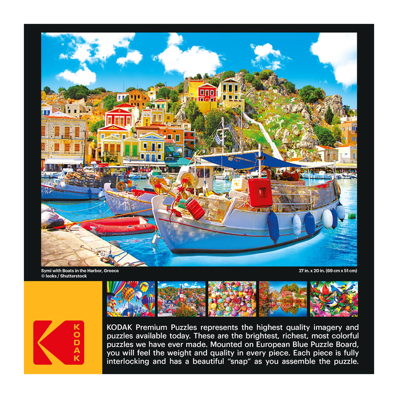 A vibrant harbor scene in Symi, Greece, is depicted on a RoseArt - Kodak Premium - Symi with Boats in the Harbor, Greece - 1000 Piece Jigsaw Puzzle box, featuring colorful boats and buildings. Detailed information about the puzzle quality is provided below the image.