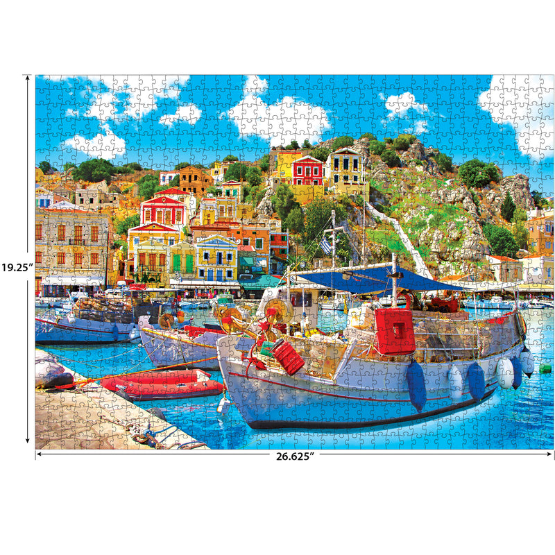 A completed RoseArt - Kodak Premium - Symi with Boats in the Harbor, Greece - 1000 Piece Jigsaw Puzzle depicting a vibrant coastal village with colorful buildings, boats docked at a harbor, and a bright blue sky with fluffy clouds. Puzzle dimensions are 19.25" x 26.625".