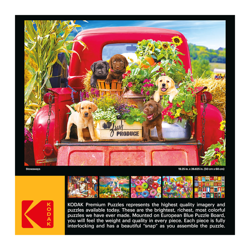 A puzzle box showing an image of six puppies in an old red truck filled with flowers. The front text describes RoseArt - Kodak Premium - Stowaways - 1000 Piece Jigsaw Puzzle's quality, imagery, and interlocking pieces.