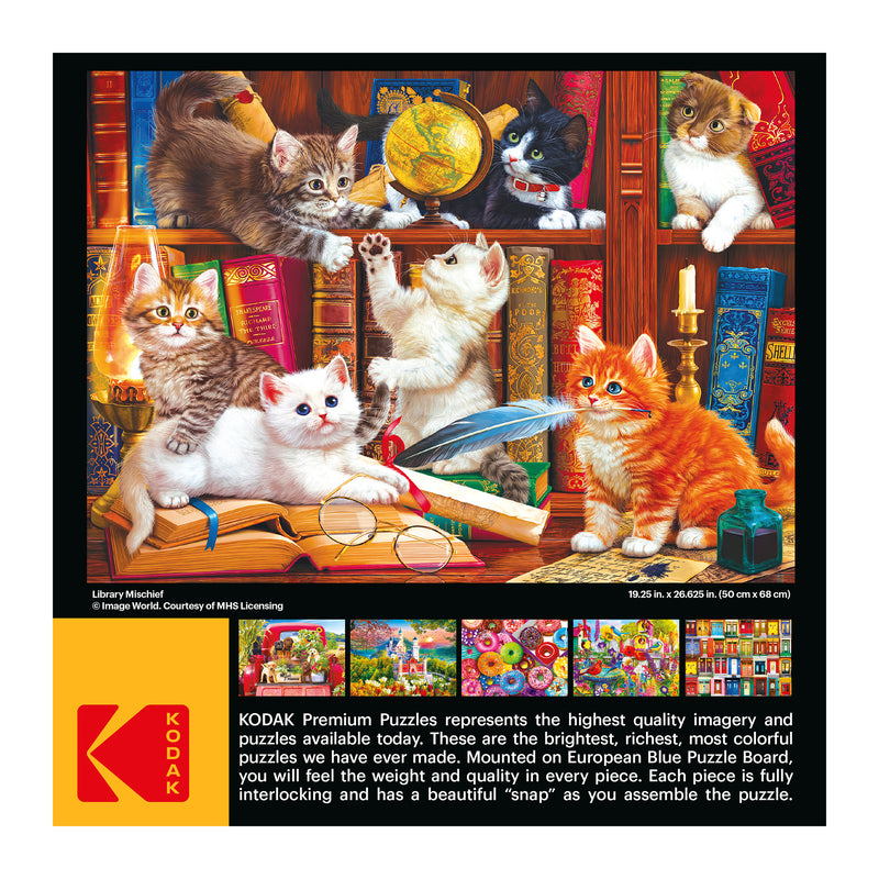 A RoseArt Kodak Premium Jigsaw Puzzle box featuring the delightful "Library Mischief" scene with playful kittens in a cozy library. The box provides the puzzle's dimensions and emphasizes the exceptional quality and vividness that Kodak Premium Puzzles are renowned for.