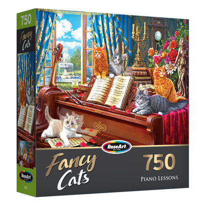 A 750-piece puzzle titled "RoseArt - Fancy Cats - Piano Lessons - 750 Piece Jigsaw Puzzle" by RoseArt, featuring colorful cats sitting on and around a piano with sheet music, flowers, and a picturesque garden visible through the window.