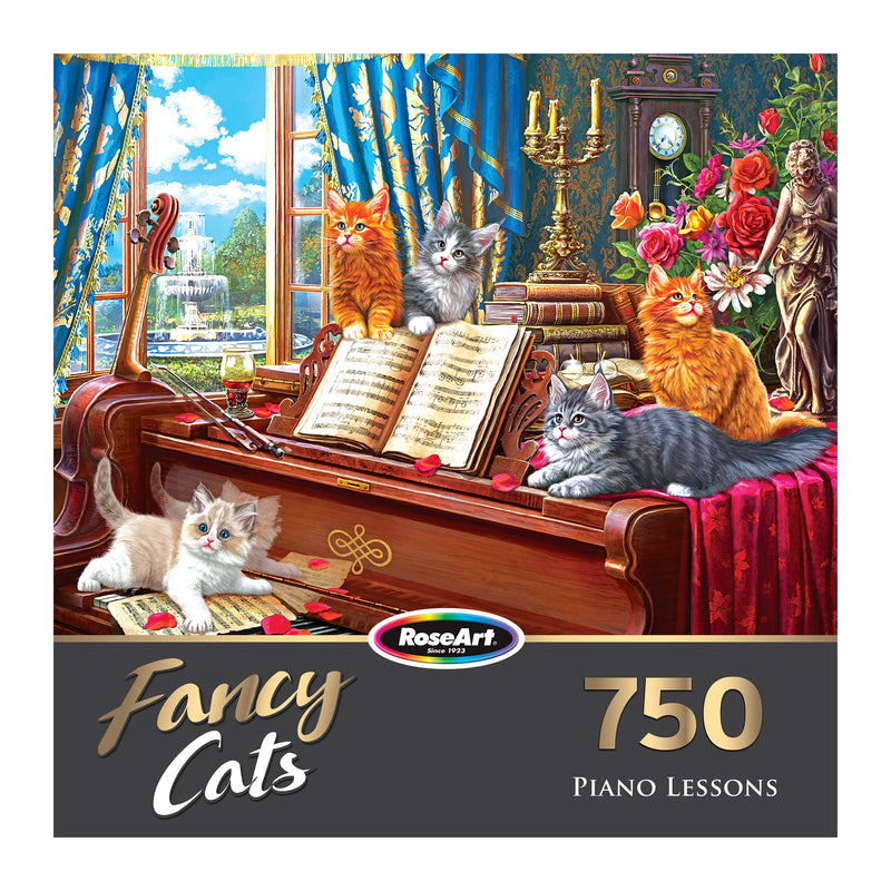 Puzzle box labeled "RoseArt - Fancy Cats - Piano Lessons - 750 Piece Jigsaw Puzzle" with five kittens sitting on and around a piano, surrounded by flowers and a scenic outdoor backdrop. The box indicates 750 pieces by RoseArt.