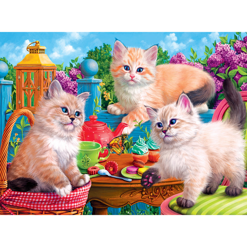 Three fluffy kittens playing on a table with colorful teacups, cupcakes, and pastries in a vibrant garden setting are depicted perfectly in the RoseArt - Fancy Cats - Kitten Tea Party - 750 Piece Jigsaw Puzzle. A lantern and blooming flowers enhance the outdoor scene.