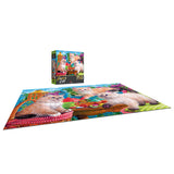A completed RoseArt - Fancy Cats - Kitten Tea Party - 750 Piece Jigsaw Puzzle depicting cats in a colorful garden, with the puzzle box showing the same image in the background.