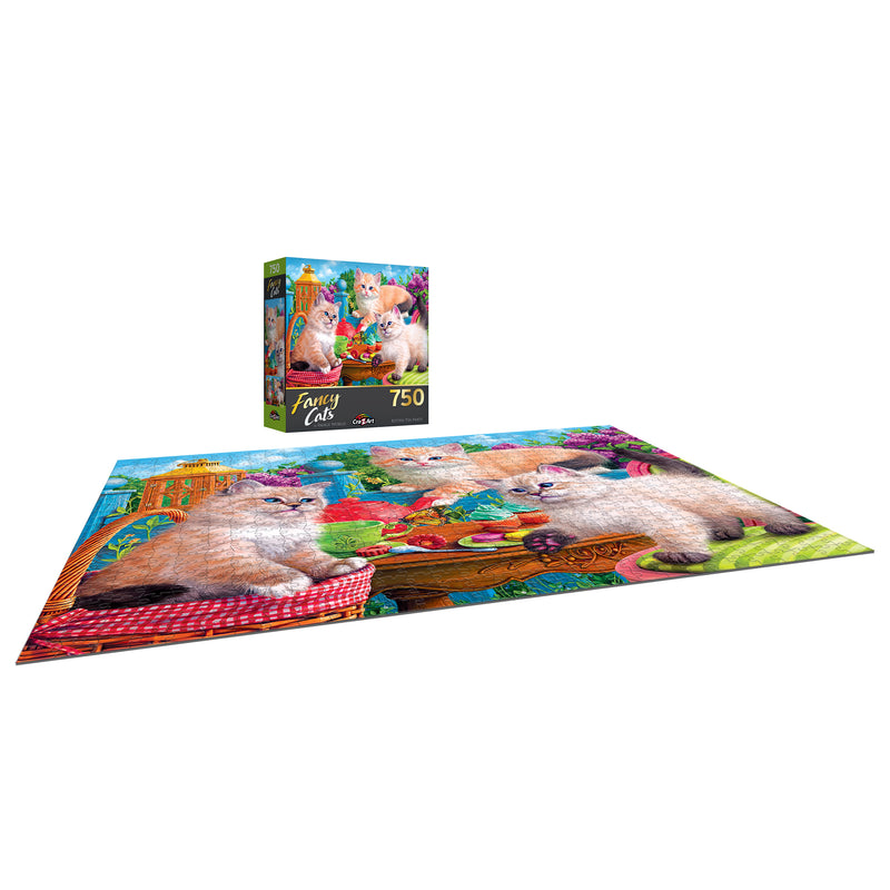 A completed RoseArt - Fancy Cats - Kitten Tea Party - 750 Piece Jigsaw Puzzle depicting cats in a colorful garden, with the puzzle box showing the same image in the background.