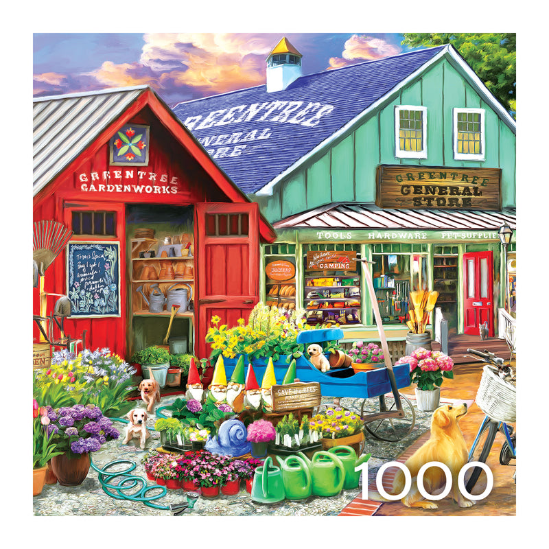 The ROSEART - HOBBY HAVEN - GREENTREE GARDEN CENTER - 1000 PIECE JIGSAW PUZZLE portrays a lively garden store with flowers, statues, garden tools, and bicycles. In the foreground are a playful dog and cat. A nearby "General Store" adds to the cozy scene.