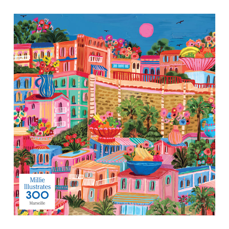 The ROSEART - MILLIE ILLUSTRATES - MARSEILLE 300-piece puzzle features a vibrant illustration of a Mediterranean-style town with colorful buildings, lush plants, and a bright pink sun—an ideal addition to any Millie Illustrates collection or as an engaging jigsaw for puzzle enthusiasts.
