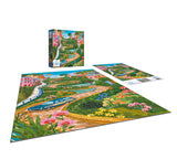 The finished 300-piece RoseArt puzzle, "Millie Illustrates - Lombard Street San Francisco," beautifully captures a scenic winding road lined with colorful houses and flowers. The vibrant puzzle box is featured in the background.