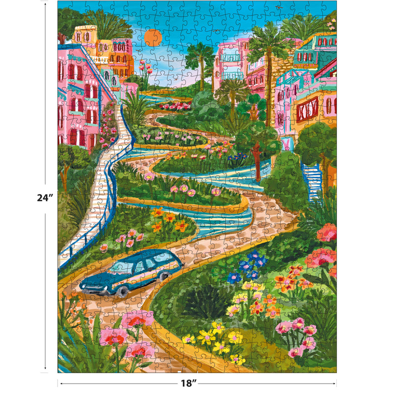 The ROSEART 300-piece jigsaw puzzle, "Lombard Street San Francisco" by Millie Illustrates, reveals an 18x24 inch scene of a colorful winding street with a blue car, vibrant houses, lush gardens, and a bright blue sky.