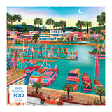 The ROSEART - MILLIE ILLUSTRATES jigsaw puzzle features a colorful painting of the Vieux Port de Cannes harbor, with numerous boats, lush greenery, a crescent moon in the sky, and a car parked on the waterfront street.