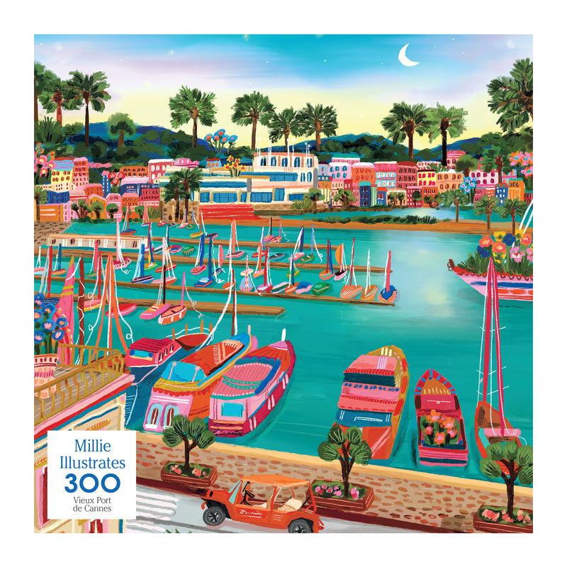 The ROSEART - MILLIE ILLUSTRATES jigsaw puzzle features a colorful painting of the Vieux Port de Cannes harbor, with numerous boats, lush greenery, a crescent moon in the sky, and a car parked on the waterfront street.