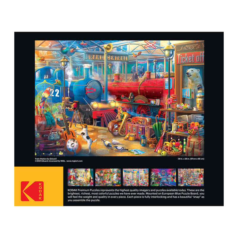 Colorful box showing a RoseArt - Kodak Collector - Train Station - 2000 Piece Jigsaw Puzzle of a vibrant, detailed toy workshop scene with various tools, trains, and toys, with smaller images and a product description below.