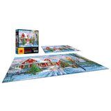 A completed RoseArt - Kodak Premium - Christmas at Home - 1000 Piece Jigsaw Puzzle depicting a snowy scene with a red house and Christmas decorations. The puzzle box is also shown with the same image.