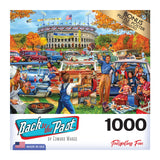 Colorful puzzle box featuring a vintage tailgating scene in a stadium parking lot. The label reads "RoseArt - Back to the Past - Tailgating Fun - 1000 Piece Jigsaw Puzzle" by Edward Wargo, and includes a 1000-piece count and a bonus puzzle poster.