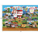A completed RoseArt - Kellogg's - Hot Air Balloon Celebration - 1000 Piece Jigsaw Puzzle featuring a colorful village scene with hot air balloons and various Kellogg's cereal box designs. The puzzle measures 20 inches by 27 inches.