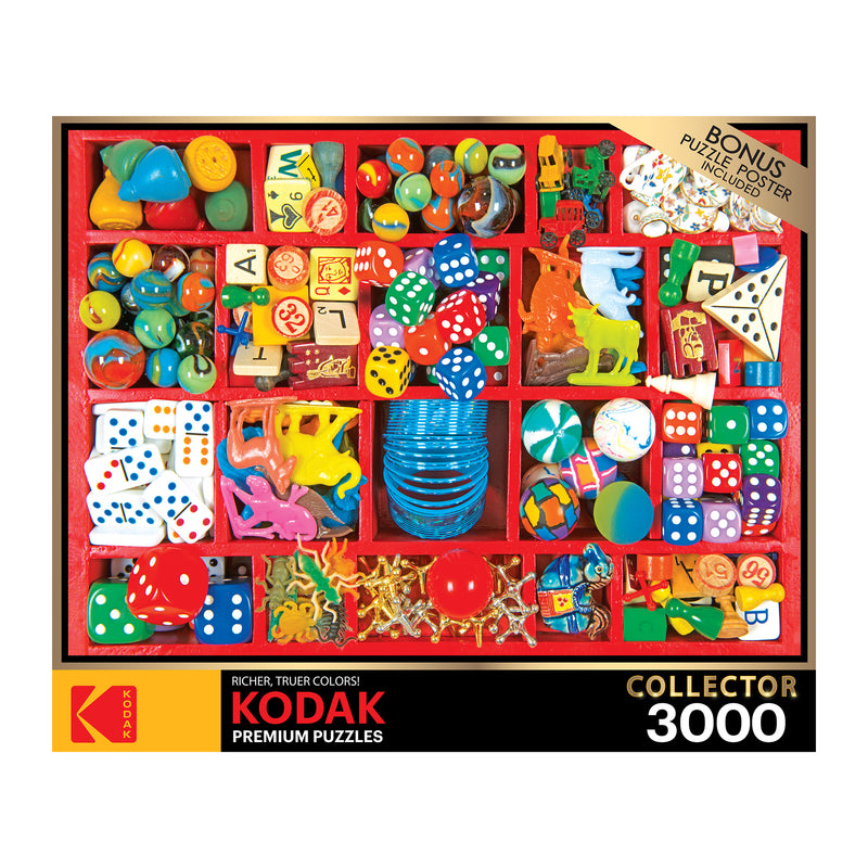 A 3000-piece RoseArt - Kodak Premium - Vintage Toy Box - 3000 Piece Jigsaw Puzzle titled "Collector," depicting an assortment of colorful toys, dice, and small objects organized in a red compartmentalized tray. Bonus puzzle poster included.