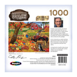 The back of a RoseArt - Chris Bigelow - Fall Harvest - 1000 Piece Jigsaw Puzzle box features autumn farm scenery with a barn, pumpkins, a dog, and a man’s image in an upper-right circle. Text mentions "Chris Bigelow" and the title "Fall Harvest.