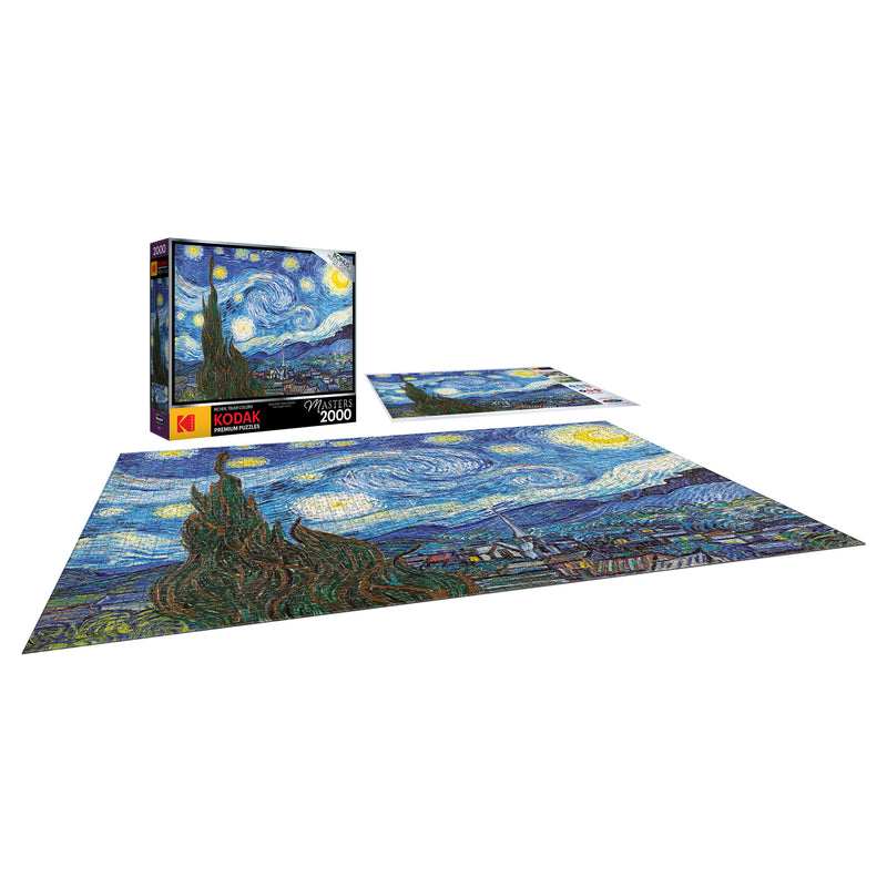 A completed 2000-piece RoseArt - Kodak Masters - The Starry Night by Vincent Van Gogh - 2000 Piece Jigsaw Puzzle. The puzzle box and an additional puzzle section are visible next to the finished work.