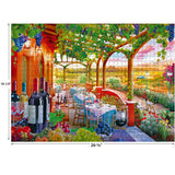 RoseArt - Kodak Cork - Wine Country - 1000 Piece Jigsaw Puzzle depicting an outdoor dining scene with a vineyard view. Tables are set with wine bottles and glasses under a pergola with hanging grapevines. Dimensions are 26.75 by 19.25 inches.