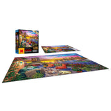 A completed 1000-piece RoseArt - Kodak Cork - Manhattan Balcony Sunset - 1000 Piece Jigsaw Puzzle is shown next to its box.