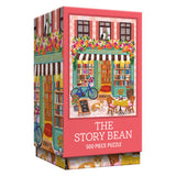 The ROSEART VERTICAL VISIONS "The Story Bean" 500 piece jigsaw puzzle features an illustrated bookstore café with flowers, a bicycle, books, and outdoor seating.
