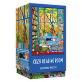 Relax with the ROSEART VERTICAL VISIONS Cozy Reading Room 500 Piece Jigsaw Puzzle, featuring a charming book-filled space, lush plants, a bright window, and a cat lounging on a blue-checked sofa.