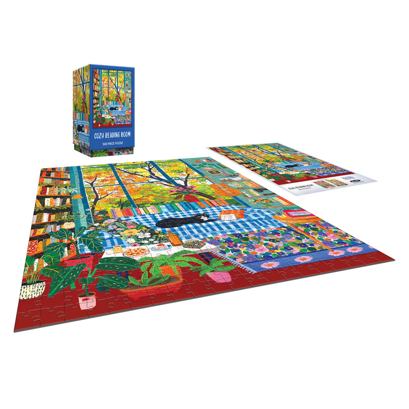 The ROSEART VERTICAL VISIONS Cozy Reading Room 500 Piece Jigsaw Puzzle features a vibrant, plant-filled reading room scene, partially assembled next to its box and reference image.