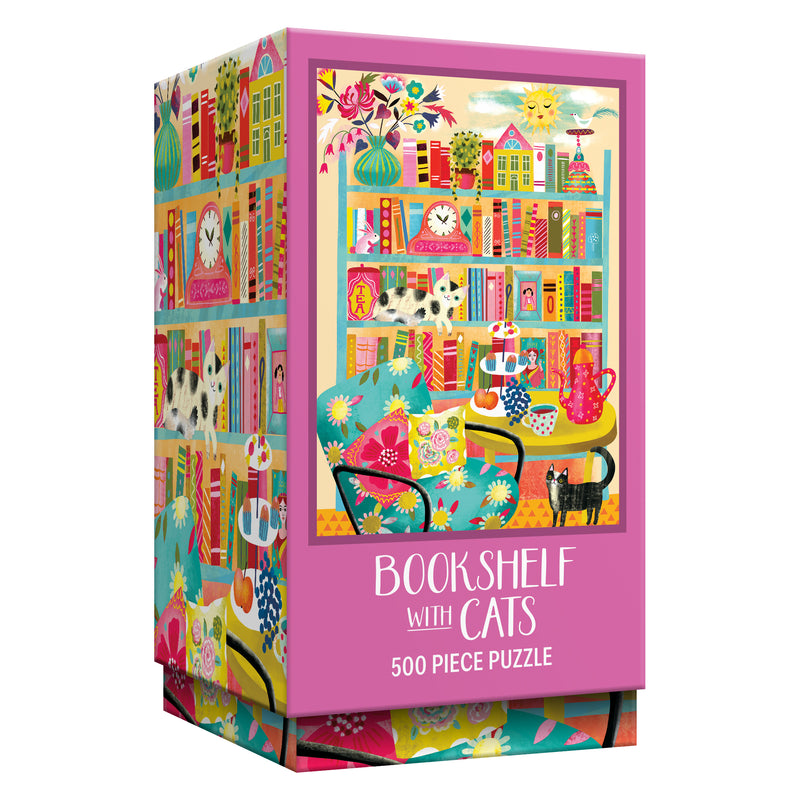 The ROSEART VERTICAL VISIONS "Bookshelf with Cats" is a 500 piece jigsaw puzzle featuring an illustrated bookshelf filled with cats, books, and cozy decor.
