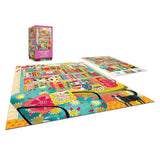 The ROSEART - VERTICAL VISIONS - Bookshelf with Cats 500 piece jigsaw puzzle features a cozy room scene with bookshelves, flowers, a chair, and black cats; includes the puzzle box and reference image.