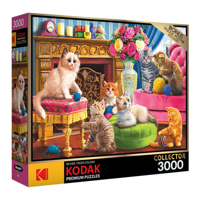 Box of a RoseArt - Kodak Premium - Kittens by the Fireplace - 3000 Piece Jigsaw Puzzle featuring an image of several kittens playing with yarn in a luxurious, ornate indoor setting.