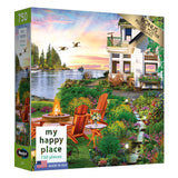 A RoseArt - My Happy Place - Harbor House - 750 Piece Jigsaw Puzzle box displaying an image of a scenic lakeside house with a garden, two red chairs by a fire pit, and flying geese at sunset. The box mentions a bonus puzzle poster included.
