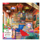 Colorful cafe interior with eclectic decor, featuring shelves stocked with items, a menu board, various seating, and a counter with pastries. Text reads "RoseArt - My Happy Place - Boho Coffeeshop - 750 Piece Jigsaw Puzzle," "750 pieces," and "bonus puzzle poster included.