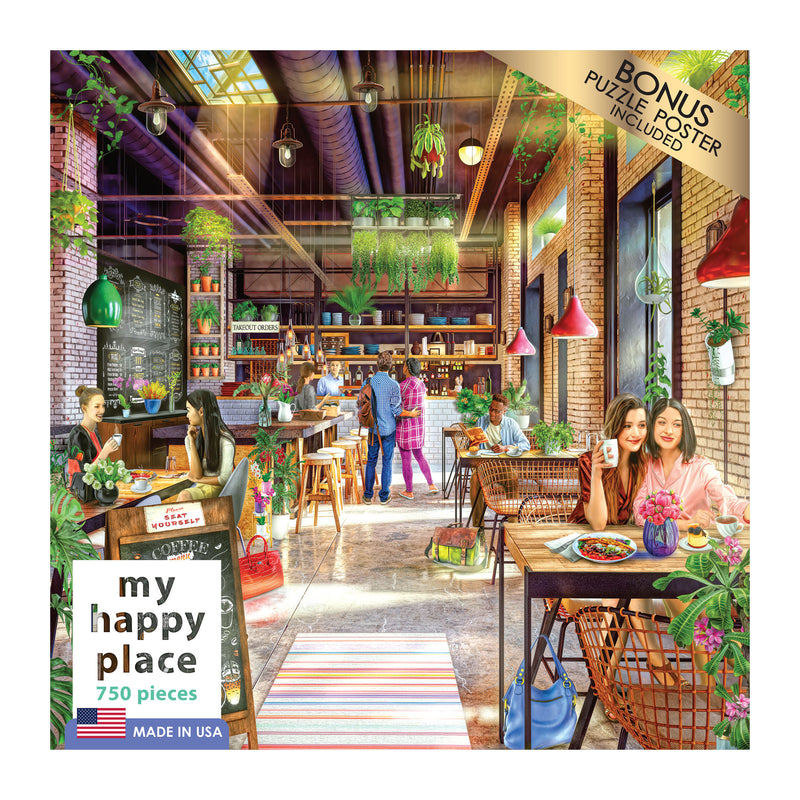 A cozy cafe with customers enjoying food and drinks. The interior features plants, hanging lights, and large windows. The scene is portrayed on the packaging of the "RoseArt - My Happy Place - The Neighborhood Cafe - 750 Piece Jigsaw Puzzle.