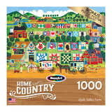 Image of a 1000-piece puzzle box titled "RoseArt - Home Country - Quilt Valley Farm - 1000 Piece Jigsaw Puzzle," featuring a colorful rural scene with a horse-drawn cart, farmhouses, and quilts. Bonus puzzle poster included.