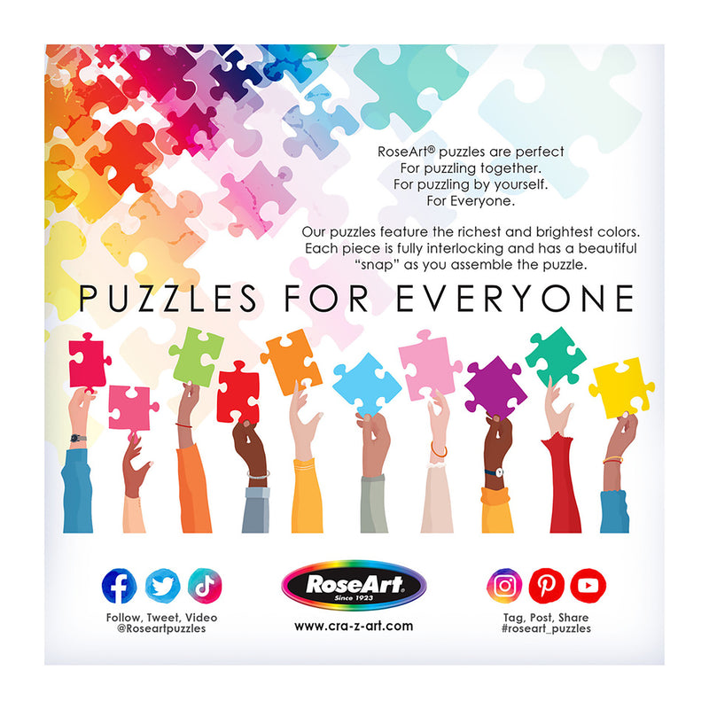 Multiple hands hold colorful puzzle pieces against a background of interlocking puzzle pieces, promoting the RoseArt - Back to the Past - Rose Motel - 1000 Piece Jigsaw Puzzle with text highlighting inclusivity, bright colors, and the joy of assembling puzzles.