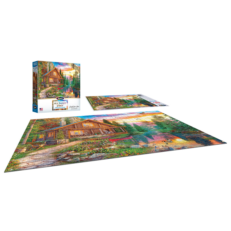 A completed RoseArt - My Happy Place - Forest Cabin Home - 1000 Piece Jigsaw Puzzle displayed alongside the puzzle box and an unused puzzle piece holder.