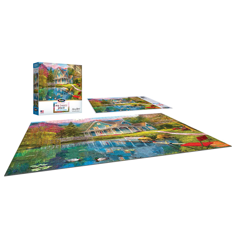 RoseArt - My Happy Place - Fishing Retreat - 1000 Piece Jigsaw Puzzle featuring an image of a colorful lakeside house with two boats, shown assembled on a flat surface and in its box.