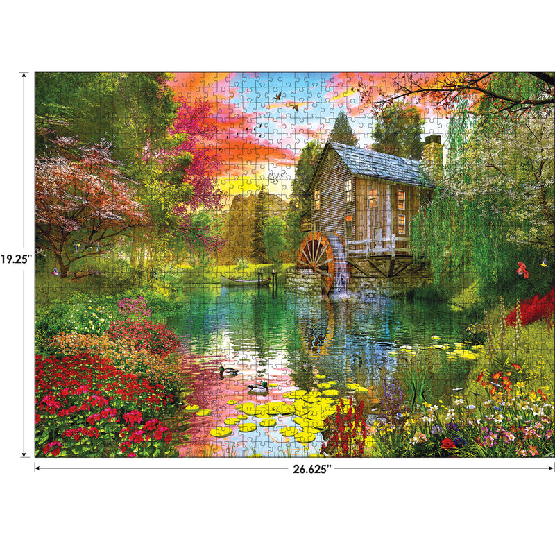 Completed RoseArt - My Happy Place - Sunset at the Mill - 1000 Piece Jigsaw Puzzle of a serene mill by a river surrounded by colorful flowers and trees, with vivid sunset skies. Measurements indicate 26.625 inches by 19.25 inches.