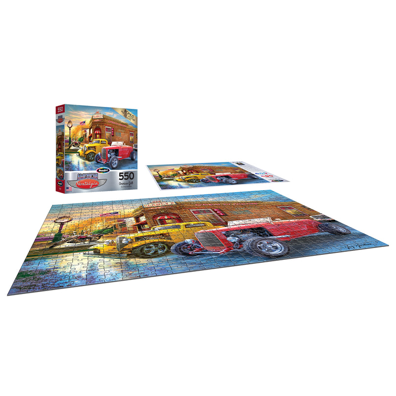 A completed RoseArt - American Nostalgia - American Grill - 500 Piece Jigsaw Puzzle depicting vintage automobiles in front of a brick building sits next to its box and a partially assembled puzzle. The box states the puzzle has 550 pieces.