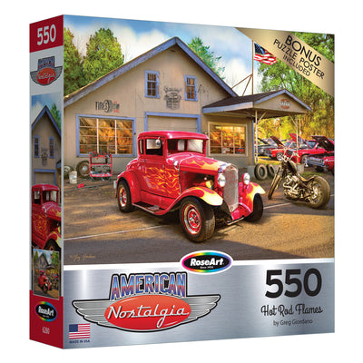 Box of a RoseArt - American Nostalgia - Hot Rod Flames - 550 Piece Jigsaw Puzzle featuring a vintage red car parked in front of an old gas station and a garage.