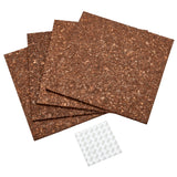 Four Board Dudes Dark Cork Tile - 4 Count 12 x 12 inches are stacked beside a sheet of adhesive stickers.