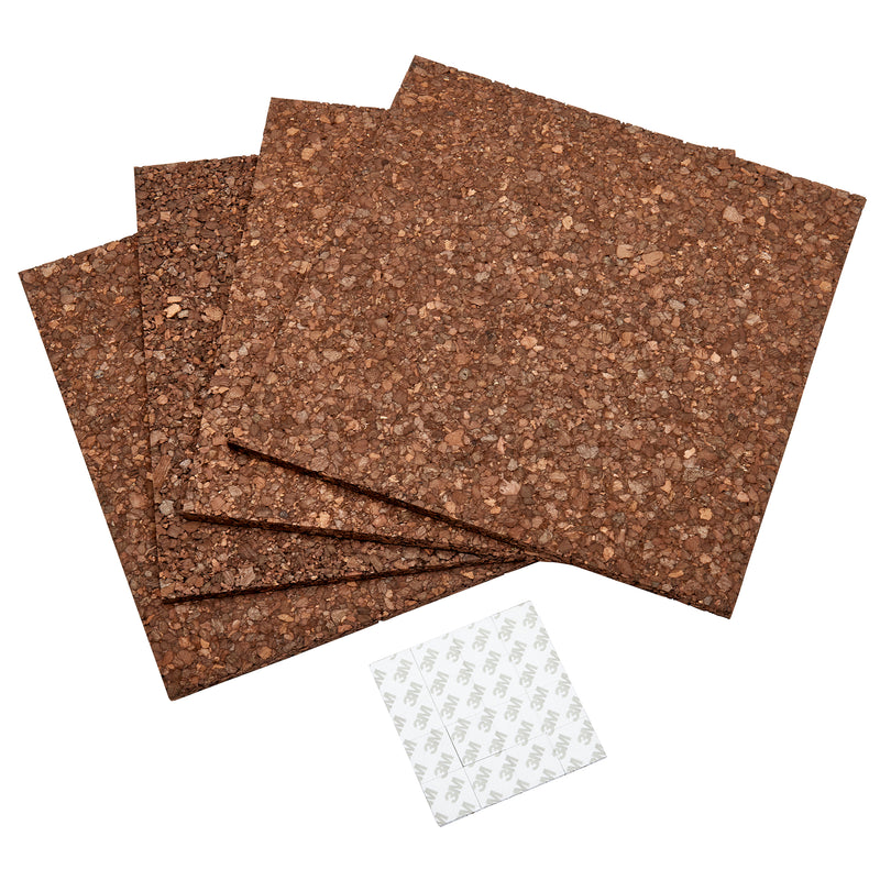 Four Board Dudes Dark Cork Tile - 4 Count 12 x 12 inches are stacked beside a sheet of adhesive stickers.