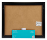 Backside of a large, black-framed Board Dudes Dry Erase Calendar Cork Magnetic Combo 22 x 18 inches: Stylish Organization for Any Space with a brown backing board. Two metal hanging clips on top. Info sheet at the bottom detailing assembly instructions and included components.