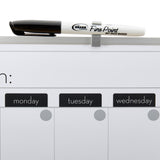 A Fine Point dry erase marker is placed horizontally on a clip at the top of a Board Dudes Dry Erase Magnetic Calendar 16x20 INCH: Elevate Your Organizational Game showing spaces for Monday, Tuesday, and Wednesday.
