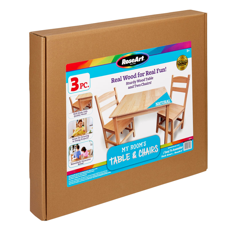 Brown cardboard packaging showing an image of a wooden table and two chairs. The box is for a RoseArt My Room's Table & Chairs: Stylish Real Wood Furniture for Creative Spaces, suitable for ages 3 and up. Brand: RoseArt.